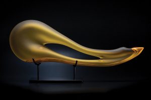 Avelino shown in yellow color is a hand blown glass sculpture by Bernard Katz
