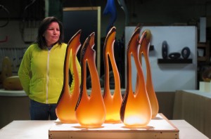Katie Katz shown with glass sculpture tall avelino group for Dubai installation