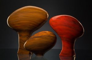 Melange Series 6 shown in cinnamon and red colors is a hand blown glass sculpture created by Bernard Katz