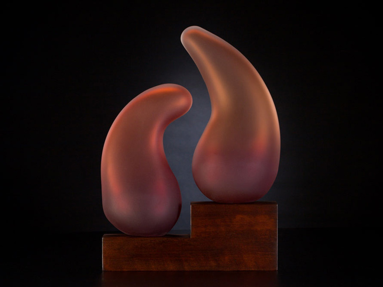 Shidoni in deep scarlet glass sculpture with wood base