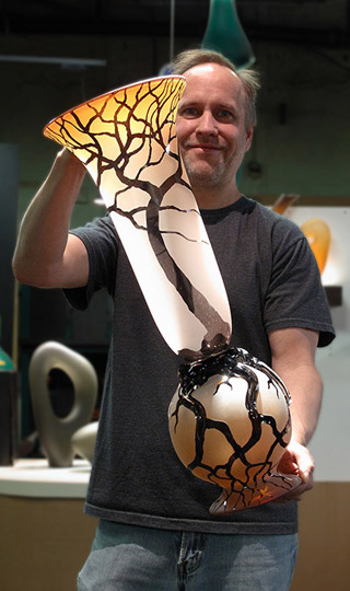 Bernard Katz holding Large Root Vase hand-blown art glass 