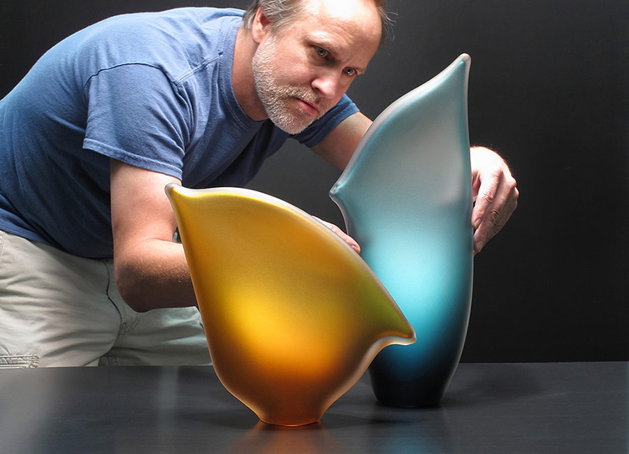 Bernard Katz adjusting Beach Horizon glass art sculpture